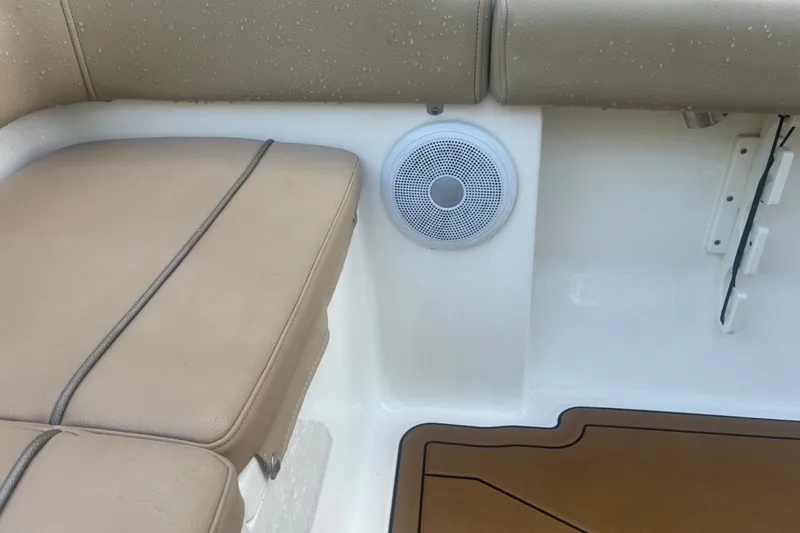 Slide: The Image of Key West 203 FS 2020 boat interior with cushioned seating and speaker. - 56