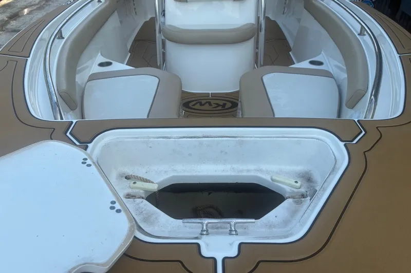 Slide: The Image of 2020 Key West 203 FS boat interior with seating and storage compartment. - 20