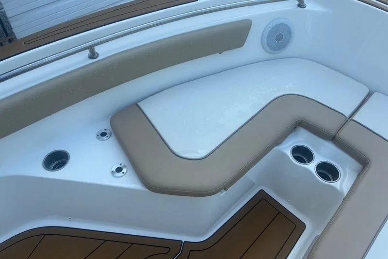 Slide: The Image of 2020 Key West 203 FS boat interior with cushioned seating and cup holders. - 41