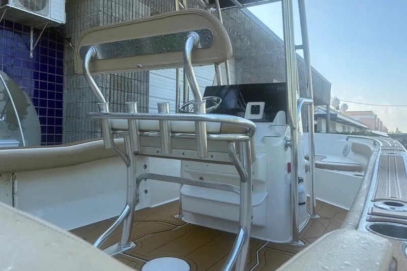 Slide: The Image of 2020 Key West 203 FS boat interior with steering console and seating. - 14