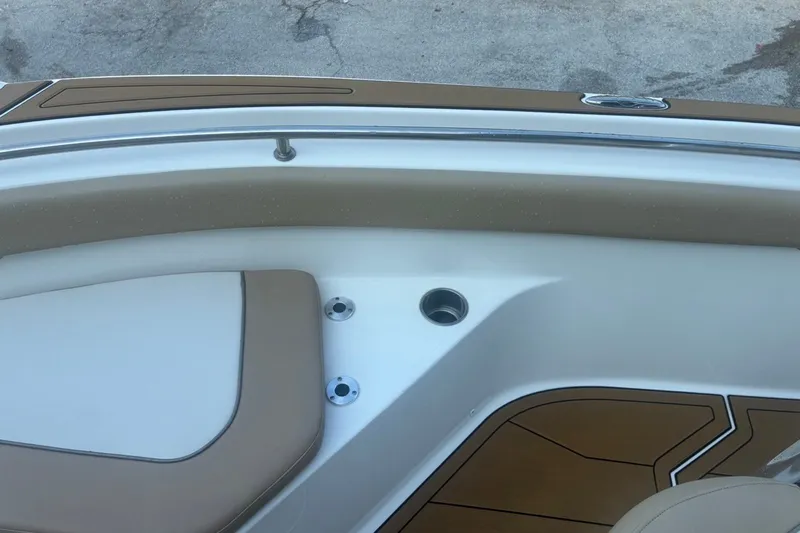 Slide: The Image of Interior view of 2020 Key West 203 FS boat with tan seating and cup holders. - 46