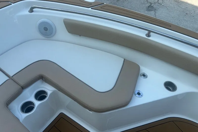 Slide: The Image of Key West 203 FS 2020 boat interior with tan seating and cup holders. - 42