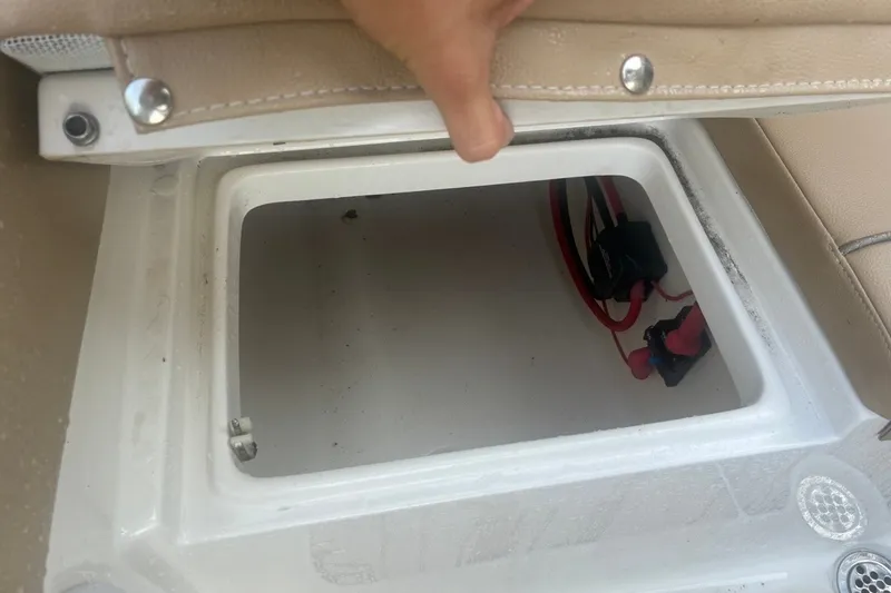 Slide: The Image of Open storage compartment in 2020 Key West 203 FS boat, showing interior and wiring. - 27