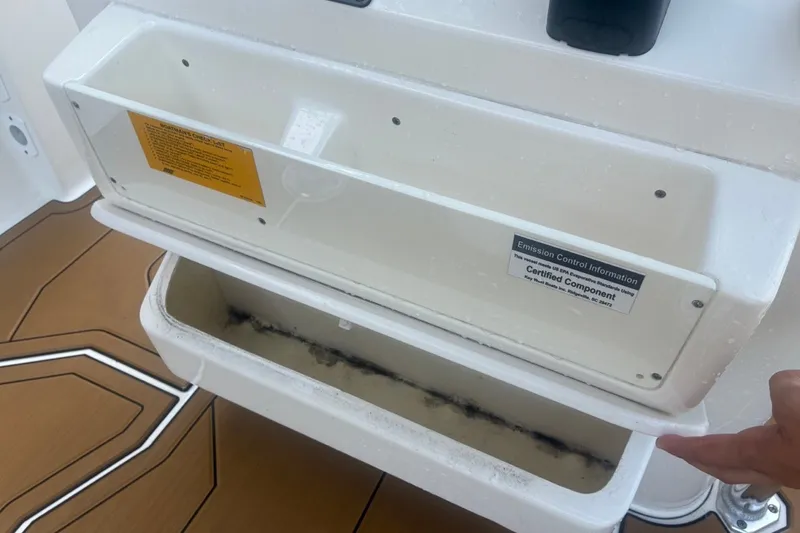 Slide: The Image of Open storage compartment on a 2020 Key West 203 FS boat, showing interior details. - 51