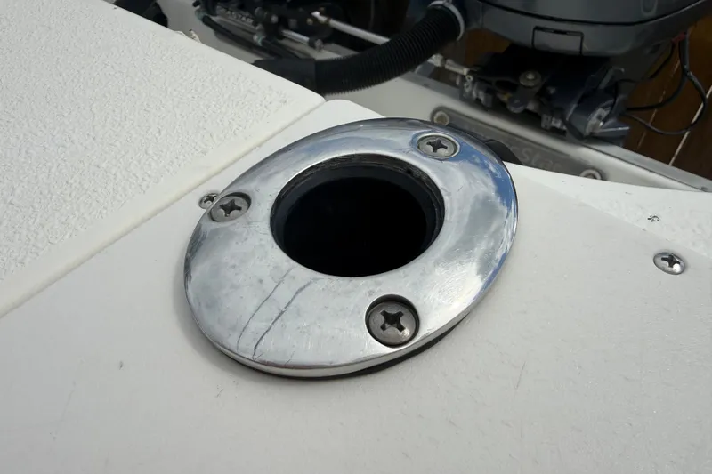 Slide: The Image of Close-up of a 2015 NauticStar 2500XS Offshore boat's stainless steel rod holder. - 44