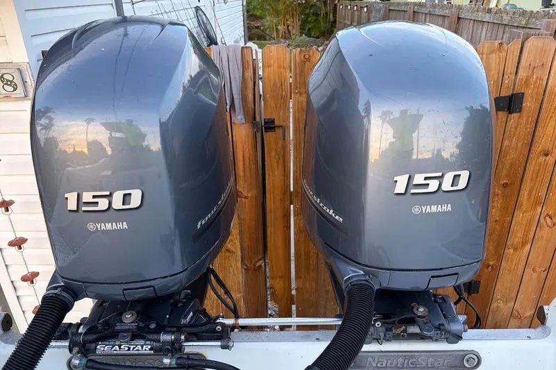 Slide: The Image of Twin Yamaha 150 outboard motors on a 2015 NauticStar 2500XS Offshore boat. - 3