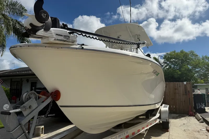 Slide: The Image of 2015 NauticStar 2500XS Offshore boat on trailer, featuring Minn Kota Terrova motor. - 16