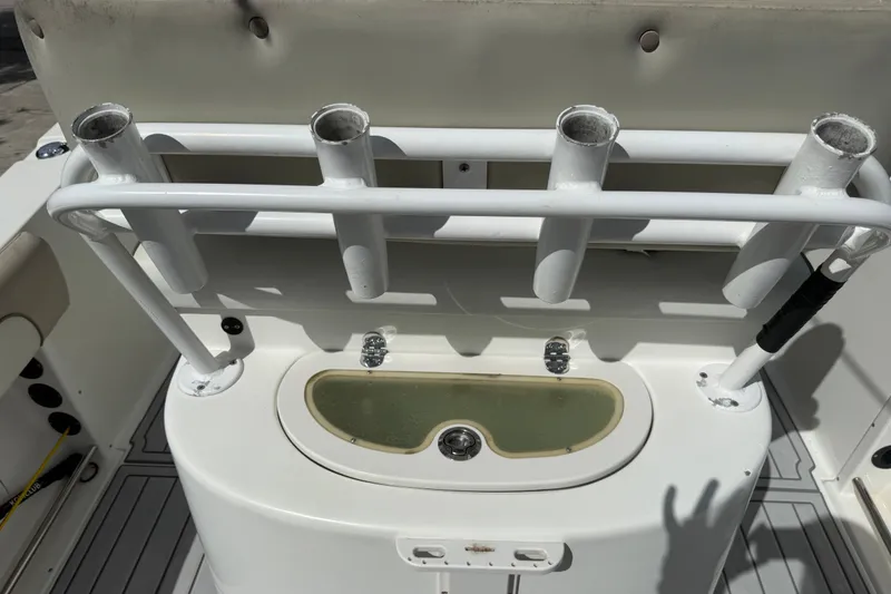 Slide: The Image of Rod holders and livewell on a 2015 NauticStar 2500XS Offshore boat deck. - 43
