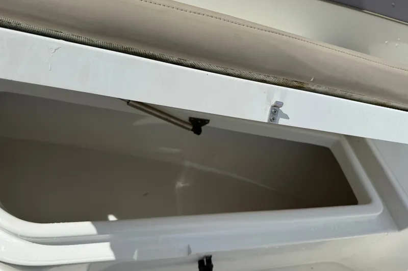 Slide: The Image of Open storage compartment on a 2015 NauticStar 2500XS Offshore boat. - 37