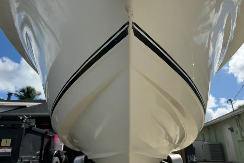 Slide: The Image of Close-up of 2015 NauticStar 2500XS Offshore boat hull with clear sky background. - 15