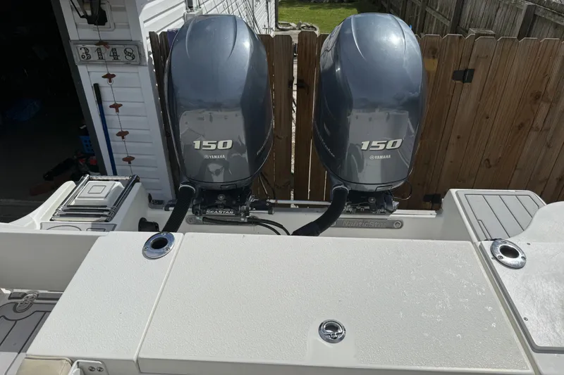 Slide: The Image of 2015 NauticStar 2500XS Offshore boat with twin Yamaha 150 engines. - 47