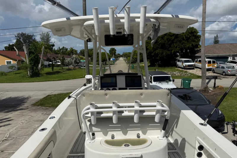 Slide: The Image of 2015 NauticStar 2500XS Offshore boat with fishing rod holders and navigation equipment. - 23