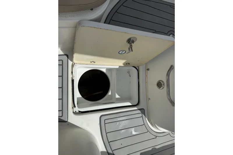 Slide: The Image of Open storage compartment on 2015 NauticStar 2500XS Offshore boat deck. - 39