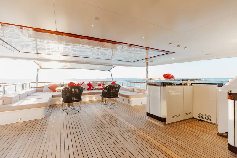 Slide: The Image of Luxurious 2016 Benetti Motoryacht deck with elegant seating and ocean view. - 46