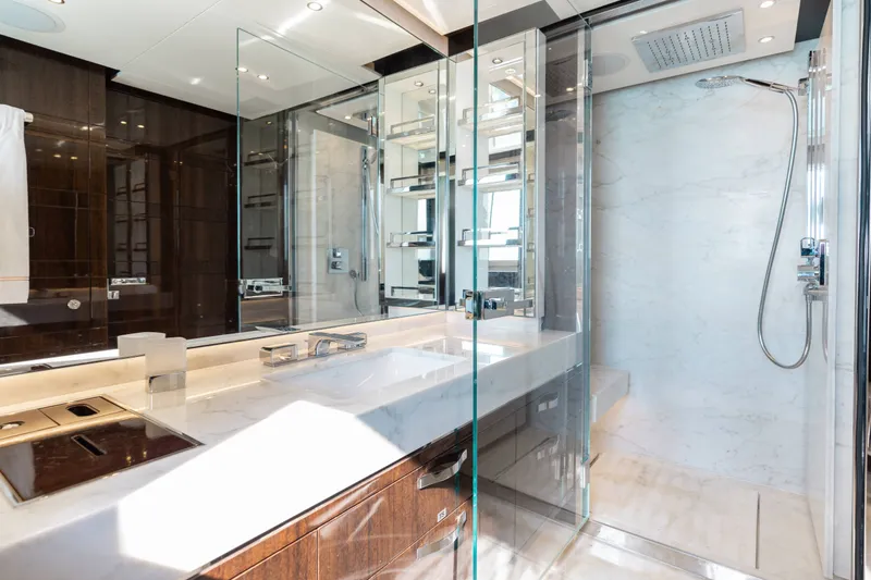 Slide: The Image of Luxurious bathroom on a 2016 Benetti Motoryacht with modern fixtures and glass shower. - 34