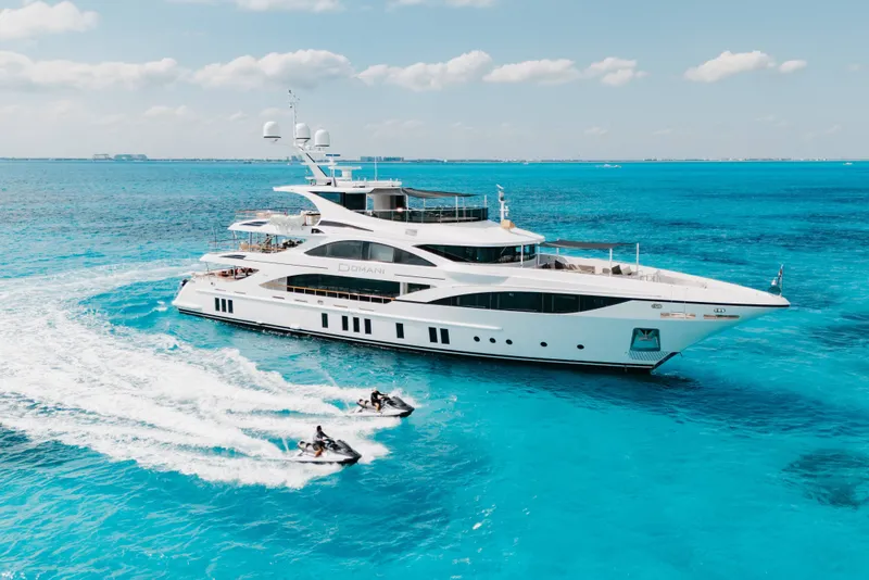 Slide: The Image of Luxurious 2016 Benetti Motoryacht cruising with jet skis on clear blue ocean. - 70