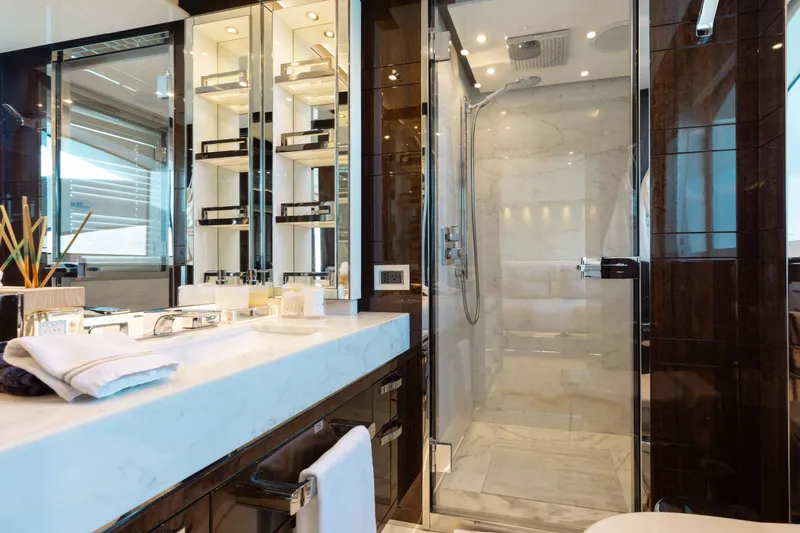 Slide: The Image of Luxurious bathroom on a 2016 Benetti Motoryacht with marble shower and elegant fixtures. - 23