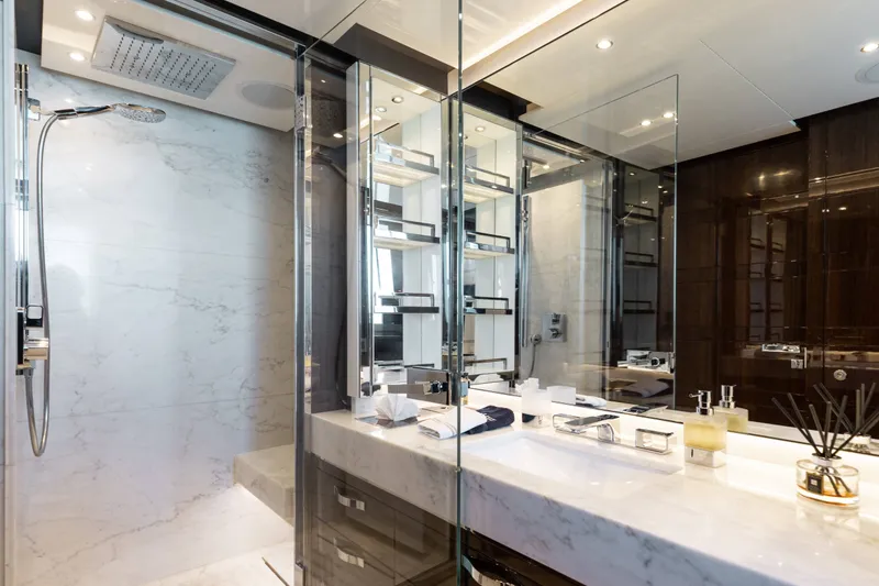 Slide: The Image of Luxurious bathroom in a 2016 Benetti Motoryacht with marble and glass accents. - 32