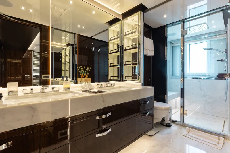 Slide: The Image of Luxurious bathroom on a 2016 Benetti Motoryacht with marble countertops and glass shower. - 29