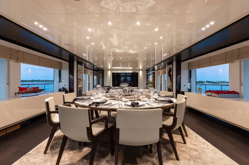 Slide: The Image of Luxurious dining area on a 2016 Benetti Motoryacht with elegant table setting and panoramic windows. - 7