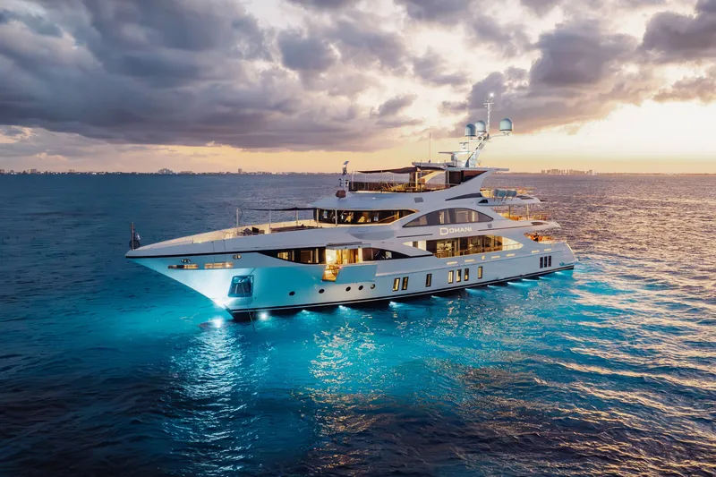 Slide: The Image of Luxurious 2016 Benetti Motoryacht cruising at sunset with illuminated waters. - 72