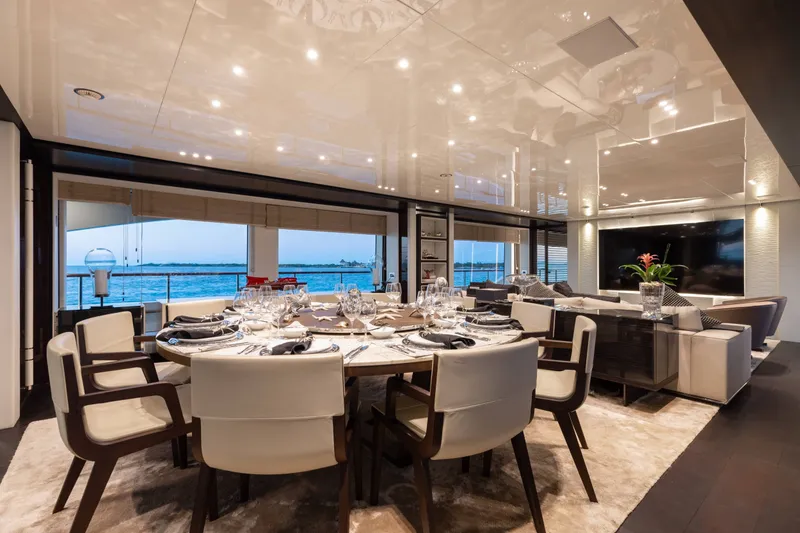 Slide: The Image of Luxurious dining area on a 2016 Benetti Motoryacht with elegant table setting and ocean view. - 6