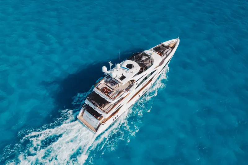 Slide: The Image of Luxurious 2016 Benetti Motoryacht cruising on vibrant blue ocean waters. - 69