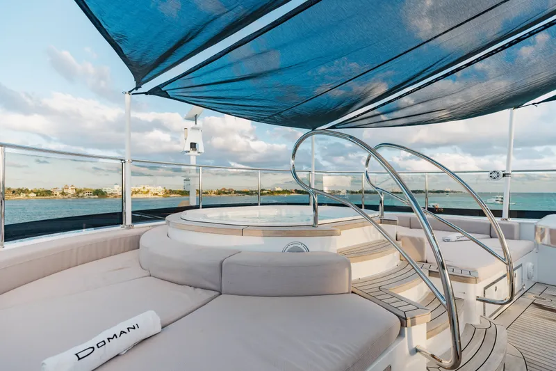 Slide: The Image of Luxurious 2016 Benetti Motoryacht deck with jacuzzi and seating under a blue canopy. - 55