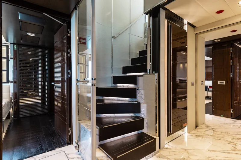 Slide: The Image of Luxurious interior of a 2016 Benetti Motoryacht featuring elegant stairs and modern design. - 18