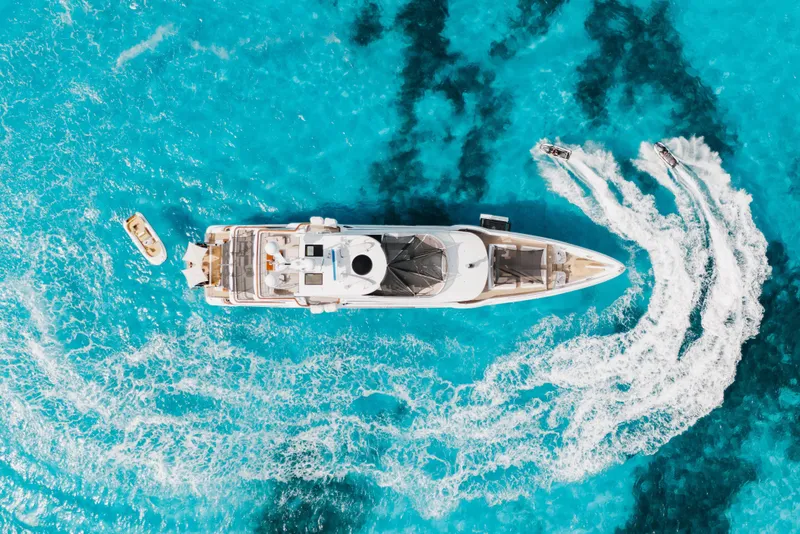 Slide: The Image of Aerial view of 2016 Benetti Motoryacht on vibrant blue ocean with jet skis. - 71