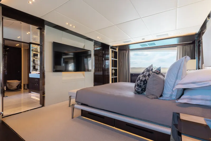 Slide: The Image of Luxurious bedroom interior of a 2016 Benetti Motoryacht with modern decor and large window view. - 12