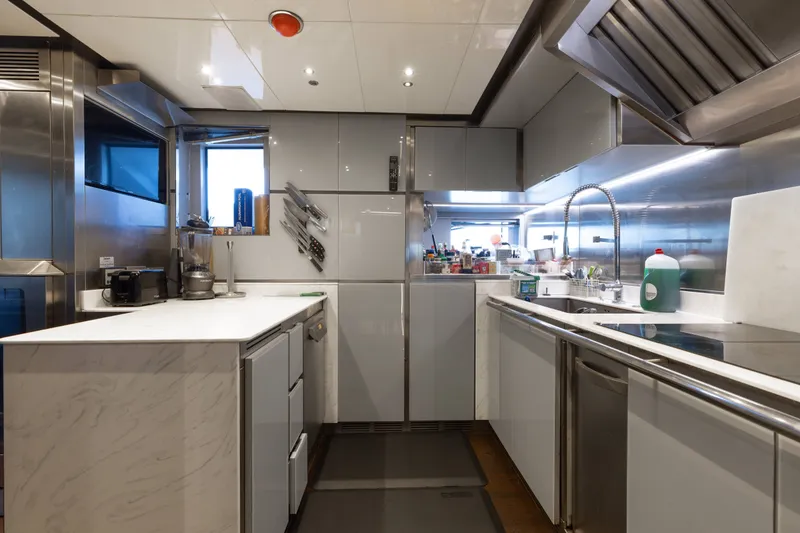 Slide: The Image of Modern kitchen interior on a 2016 Benetti Motoryacht, featuring sleek countertops and stainless steel appliances. - 35