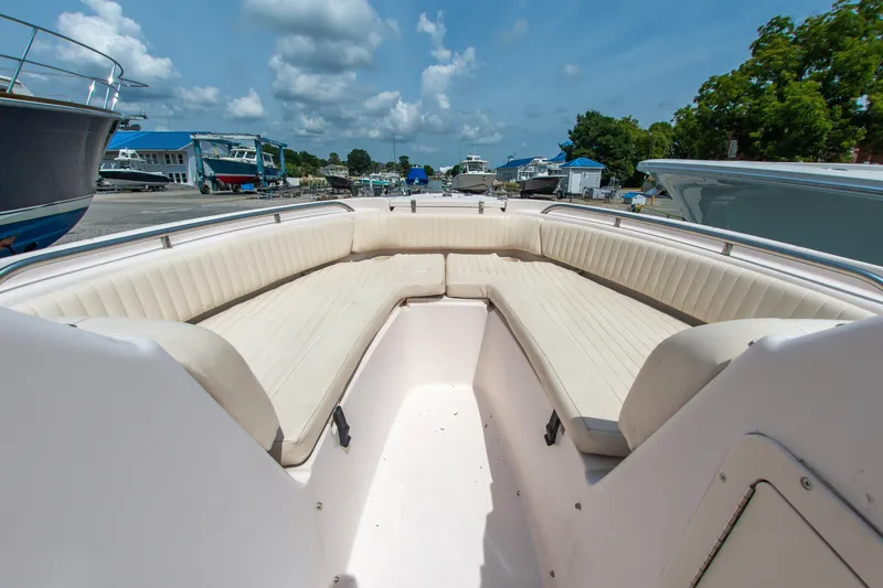 Slide: The Image of 2007 Grady-White Tournament 205 boat interior with spacious seating under a blue sky. - 2