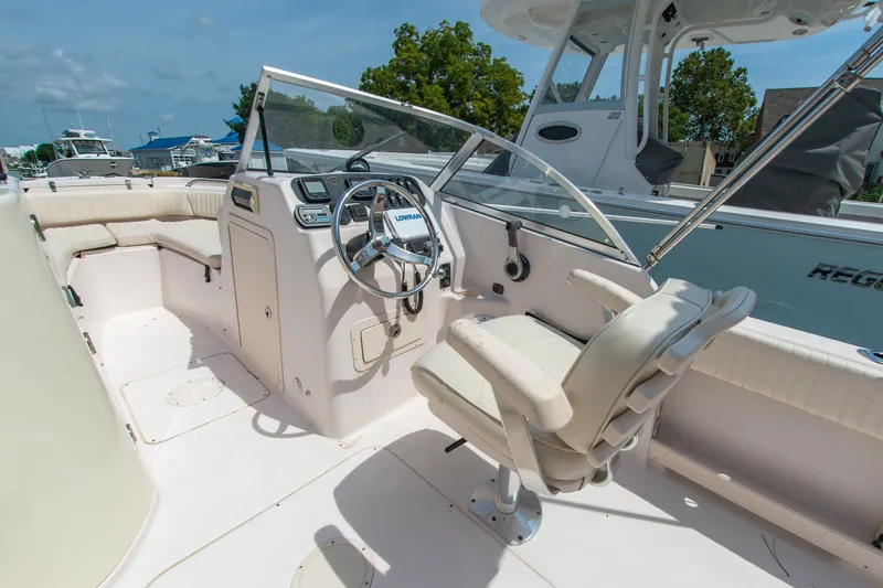 Slide: The Image of 2007 Grady-White Tournament 205 boat interior with steering wheel and seating. - 11