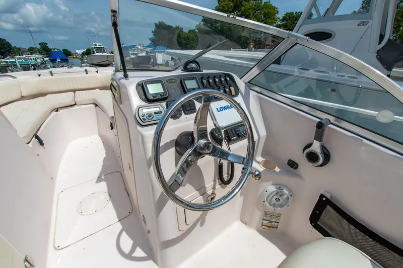 Slide: The Image of 2007 Grady-White Tournament 205 boat cockpit with steering wheel and control panel. - 1