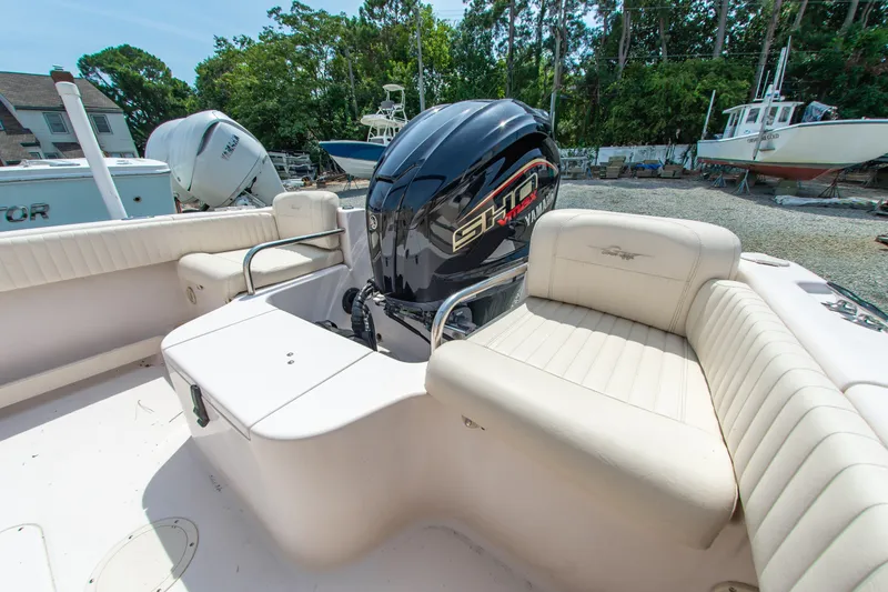 Slide: The Image of 2007 Grady-White Tournament 205 boat interior with Yamaha engine, docked outdoors. - 8