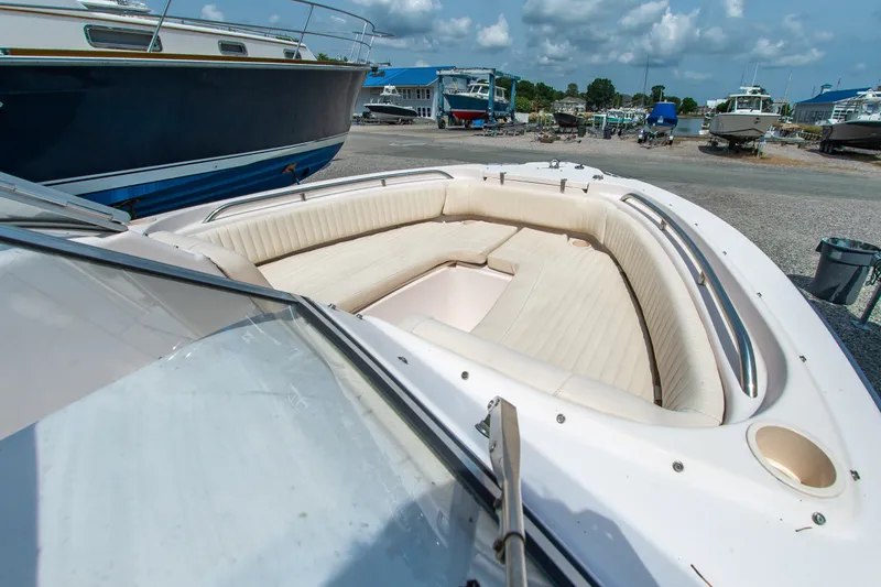 Slide: The Image of 2007 Grady-White Tournament 205 boat with spacious seating, docked under a cloudy sky. - 5