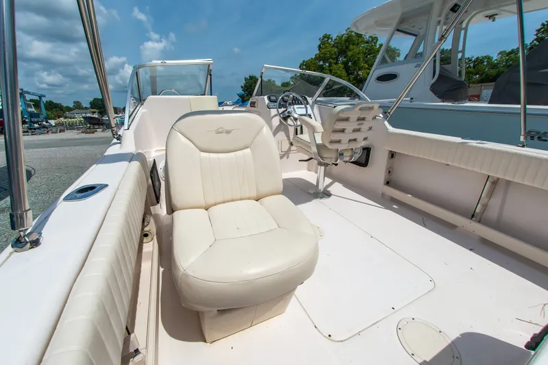 Slide: The Image of 2007 Grady-White Tournament 205 boat interior with seating and steering wheel. - 12