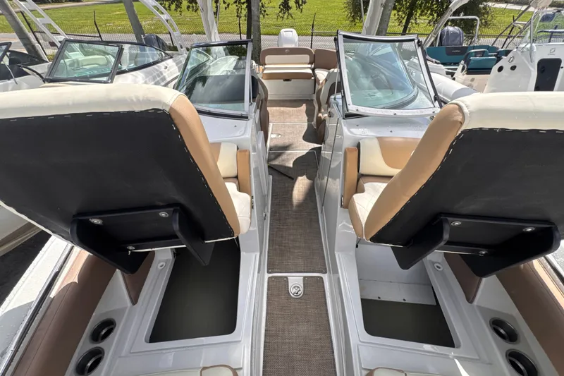 Slide: The Image of 2022 Crownline Eclipse E285 XS boat interior with dual seating and windshield. - 17