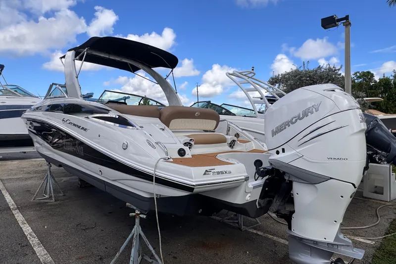Slide: The Image of 2022 Crownline Eclipse E285 XS boat with Mercury Verado engine on display. - 3