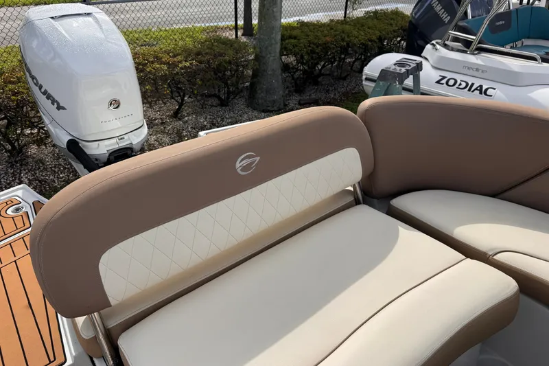 Slide: The Image of 2022 Crownline Eclipse E285 XS boat seating with Mercury outboard motor. - 10