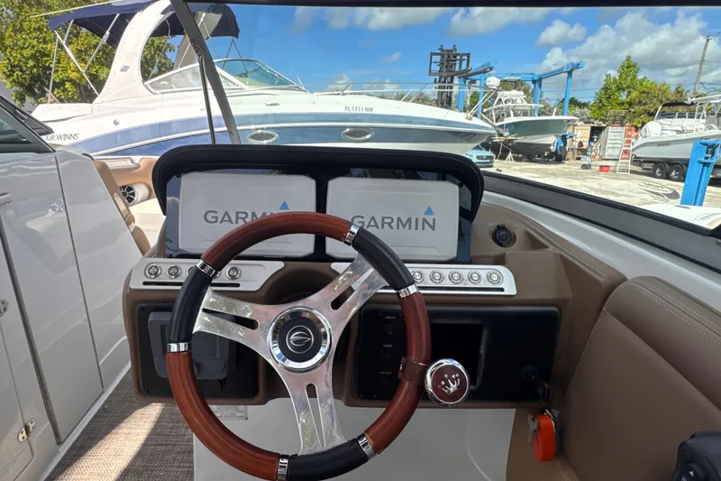 Slide: The Image of 2022 Crownline Eclipse E285 XS boat dashboard with Garmin navigation system. - 13