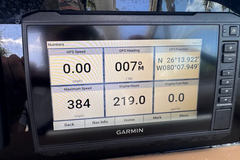 Slide: The Image of Garmin display on 2022 Crownline Eclipse E285 XS showing GPS data and engine metrics. - 18