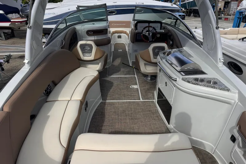 Slide: The Image of 2022 Crownline Eclipse E285 XS boat interior with luxurious seating and modern amenities. - 8