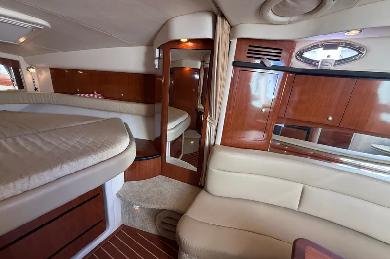 Slide: The Image of Interior of 2007 Sea Ray 340 Sundancer yacht with elegant wood and leather finishes. - 35