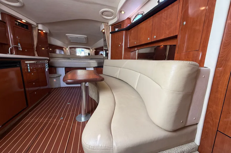 Slide: The Image of Luxurious interior of 2007 Sea Ray 340 Sundancer with leather seating and wooden cabinetry. - 40