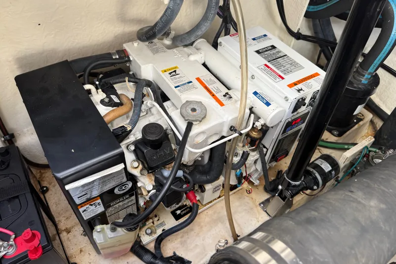 Slide: The Image of Engine compartment of a 2007 Sea Ray 340 Sundancer boat, featuring mechanical components. - 46