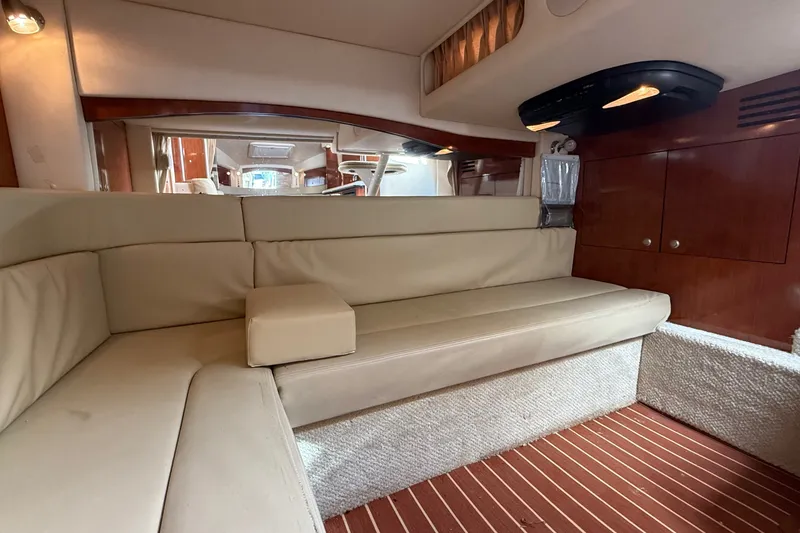 Slide: The Image of Luxurious interior of 2007 Sea Ray 340 Sundancer with beige seating and wooden accents. - 37