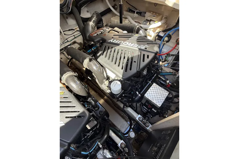 Slide: The Image of Engine compartment of a 2007 Sea Ray 340 Sundancer boat, featuring MerCruiser engines. - 45
