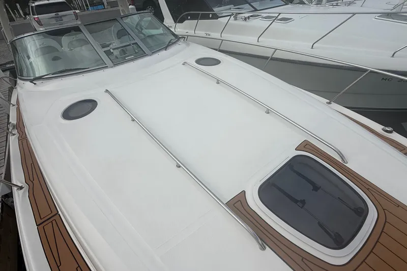 Slide: The Image of 2007 Sea Ray 340 Sundancer yacht with sleek deck design and modern features. - 13